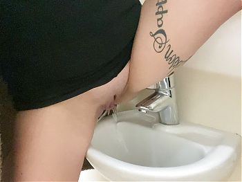Classy pisses in the sink in the disabled public toilet 